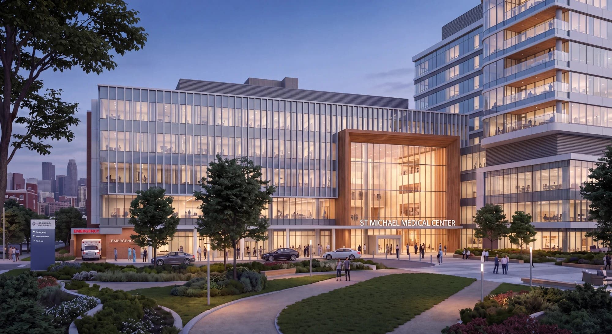 Dusk render of a hospital entrance with a timber-framed atrium, an emergency bay, and landscaped grounds